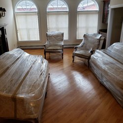 Military Movers of America - Antique living room set shrink wrapped for storage.