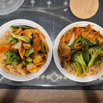 Magic Wok - two bowls of food on a table - Chinese Near Me - Mansfield, Ohio