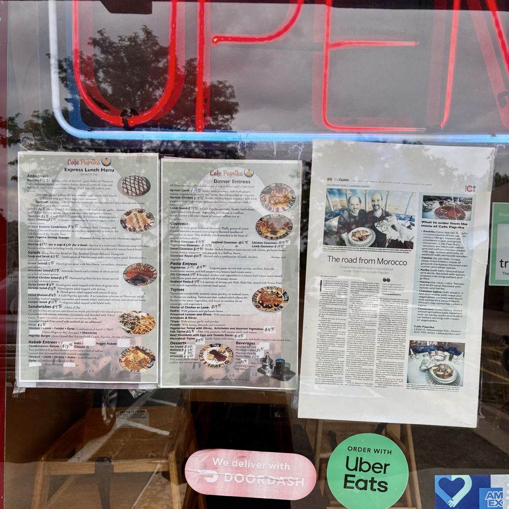 Menu and magazine article about restaurant are present on window