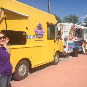 Rolling Cones - a woman standing in front of a food truck - Food Trucks Near Me