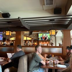 The Bungalow Neighborhood Hub - Bar and booths straight ahead