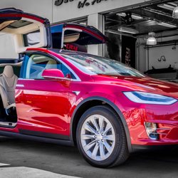 Photo of Sticker City - Sherman Oaks, CA, US. Red Tesla Model X fully protected with XPEL Ultimate Clear Bra Paint Protection.