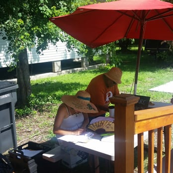 Sankofa - a man sitting under an umbrella - Farmers Market Near Me - New Orleans, Louisiana