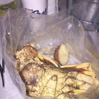 The Crab Shack - Dungeness crab and potatoes in the bag with garlic butter. - Cajun/Creole Near Me - Gardena, California The Crab Shack - Dungeness crab and potatoes in the bag with garlic butter. - Cajun/Creole Near Me - Gardena, California