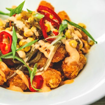 Coop 303 - VEGAN Loaded Tots: Tater tots, bourbon onions, corn chow chow, pickled fresno chili, vegan hot sauce aioli, and scallions. - New American Near Me - Atlantic Beach, Florida Coop 303 - VEGAN Loaded Tots: Tater tots, bourbon onions, corn chow chow, pickled fresno chili, vegan hot sauce aioli, and scallions. - New American Near Me - Atlantic Beach, Florida
