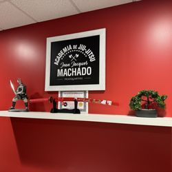Jean Jacques Machado Brazilian Jiu-Jitsu Academy - Display showing gift and certificate given to Jean Jacques Machado displayed in the Academy office