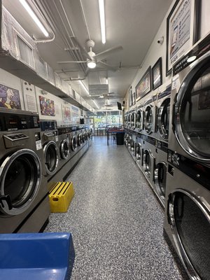 Laundromat Facilities - Visit our website or call today regarding your laundry service needs. Our facilities & machines are regularly cleaned to ensure a sanitary and hygienic experience. We recently renovated our facilities so all of our equipment is modern and functional. Laundromat Facilities - Visit our website or call today regarding your laundry service needs. Our facilities & machines are regularly cleaned to ensure a sanitary and hygienic experience. We recently renovated our facilities so all of our equipment is modern and functional.