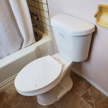 Appleton Residential Services - a white toilet in a bathroom - Handyman Near Me