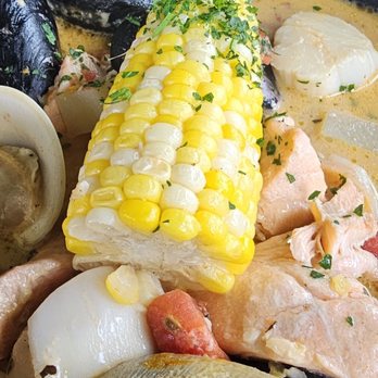 Ross' Grill - Seafood Stew and salad with shrimp - American Near Me - Provincetown, Massachusetts Ross' Grill - Seafood Stew and salad with shrimp - American Near Me - Provincetown, Massachusetts