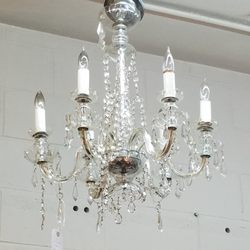 Peacock Lane Home - Many beautiful chandeliers in the shop.