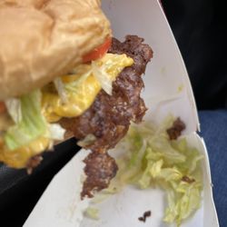 At first I thought it was bacon hanging off the side.