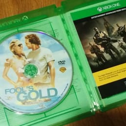 a game disc in a green case