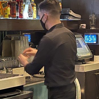 Earls Kitchen + Bar - a man working in a restaurant - Canadian (New) Near Me - Langley, British Columbia Earls Kitchen + Bar - a man working in a restaurant - Canadian (New) Near Me - Langley, British Columbia