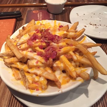 Outback Steakhouse - Aussie cheese fries are a must - Steakhouses Near Me - Amherst, New York Outback Steakhouse - Aussie cheese fries are a must - Steakhouses Near Me - Amherst, New York