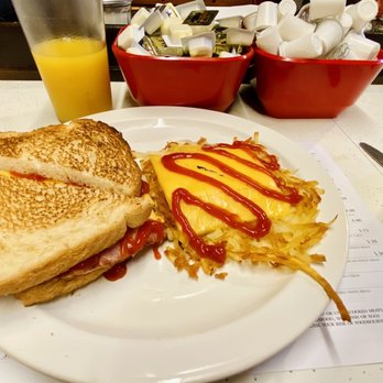 German Village Coffee Shop - Ham, egg and cheese sandwich with a side of hash browns. - Breakfast & Brunch Near Me - Columbus, Ohio German Village Coffee Shop - Ham, egg and cheese sandwich with a side of hash browns. - Breakfast & Brunch Near Me - Columbus, Ohio