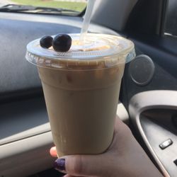 Coffee Royale - Iced Americano with two chocolate dipped coffee beans on top. Nice touch