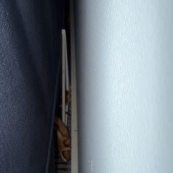 Sebasco Harbor Resort - Pizza and a hanger behind the couch. - Resorts Near Me - Sebasco Estates, Maine