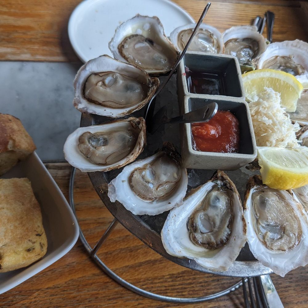 Focaccia and a dozen oysters at happy hour Focaccia and a dozen oysters at happy hour