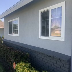 After. Neutral Wave for the stucco, Iron-IC for the brick (front of house and chimney), and Sugar Swizzle for the fascia, fence, and gate!