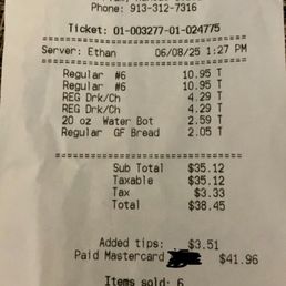Photo of bill for two half subs and chips and drink and water. Photo of bill for two half subs and chips and drink and water.