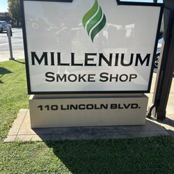 Millenium Smoke Shop - Sign