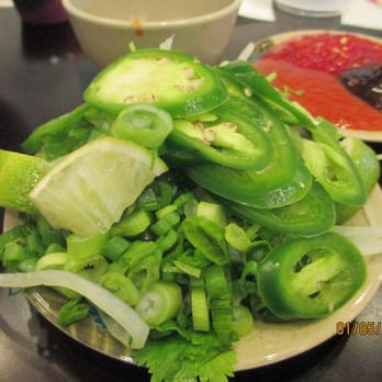 PhoNatic - oooh!  Love the condiment bar!  Green onions, white onions, cilantro, jalapenos, limes, chili sauce, oyster sauce - Vietnamese Near Me - Austin, Texas