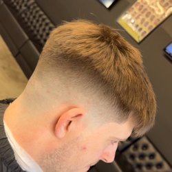 Fade It Barbershop - Mid high skin fade with messy top