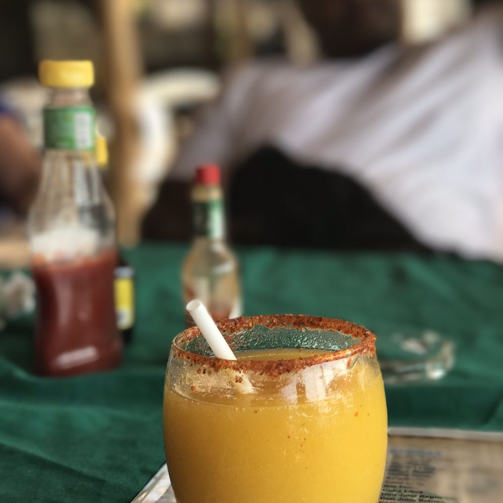 Domingo's - Mango margarita made from fresh mangos cut from the trees right outside of Domingo's! Rim of glass lined with Tajín! - Mexican Near Me - Yelapa, JAL Domingo's - Mango margarita made from fresh mangos cut from the trees right outside of Domingo's! Rim of glass lined with Tajín! - Mexican Near Me - Yelapa, JAL