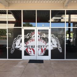Wolfpack Enterprises - Perforated window vinyl for a local gym.