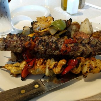 Cedars Mediterranean Kitchen - Combination Kebab. The visible skewers are great (lamb and chicken). The problematic skewer (beef) is hidden underneath. - Middle Eastern Near Me - Chicago, Illinois