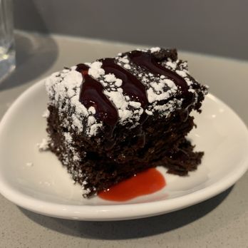 The Club - a piece of chocolate cake on a plate - Airport Lounges Near Me - Las Vegas, Nevada