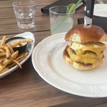 Sacred Beast - Double cheeseburger and side of fries with cheese sauce - Bars Near Me - Cincinnati, Ohio Sacred Beast - Double cheeseburger and side of fries with cheese sauce - Bars Near Me - Cincinnati, Ohio