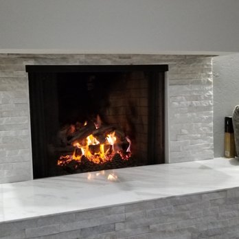 Pro Tile - Family Room Fireplace with Stacked Quartz Uprights and a Beautiful Marble Seat. - General Contractors Near Me - Sebastopol, California