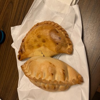 Julia's Empanadas - two empanadas on a table - Empanadas Near Me - Washington, DC, District of Columbia Julia's Empanadas - two empanadas on a table - Empanadas Near Me - Washington, DC, District of Columbia