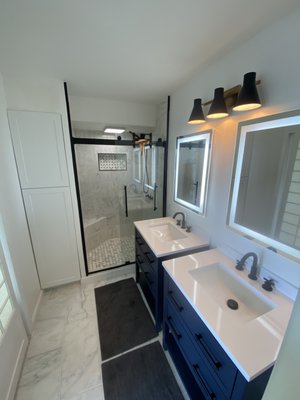 Full master bathroom remodel - This was a older master bathroom that got a full redo. Custom tile shower pan with bench seat and soap box in shower wall. Beautiful black an white color scheme. His an hers vanity sinks with new lighted mirrors. Added a full size storage closet shelf on side of shower along with new tile floors. All water fixture valves and piping replaced an tested to ensure proper working order. If this is something you have in mind we can get it done