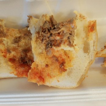 HG New Hope Pizza - a half eaten pizza in a styrofoam container - Pizza Near Me - New Hope, Pennsylvania