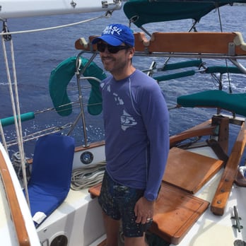 Kona Sail Charters - My husband was able to helm the sailboat. - Snorkeling Near Me - Kailua-Kona, Hawaii