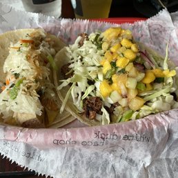 Left: Banh Mi Tofu taco with daikon and carrot slaw Right: Thai Peanut Jackfruit taco Left: Banh Mi Tofu taco with daikon and carrot slaw Right: Thai Peanut Jackfruit taco