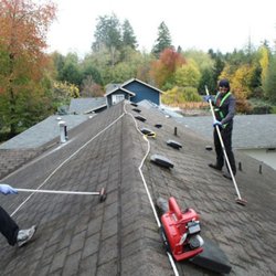 A&R Construction - Roof cleaning in Olympia using non damaging soft wire brushes