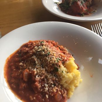 M'tucci's Moderno - Creamy polenta and sausage ragu. Meatballs in the back plate. - Italian Near Me - Rio Rancho, New Mexico