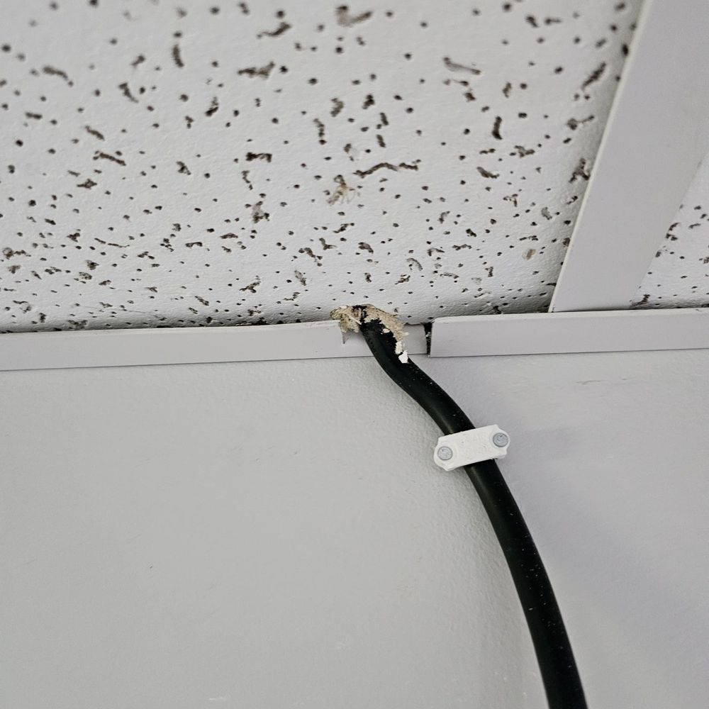 Certified Radon Solutions - Power cable just jammed through ceiling tile. - Home Inspectors Near Me - Mansfield, Massachusetts