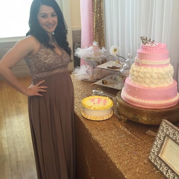 Lusitana Club - a pregnant woman standing in front of a cake - Portuguese Near Me - Cumberland, Rhode Island Lusitana Club - a pregnant woman standing in front of a cake - Portuguese Near Me - Cumberland, Rhode Island