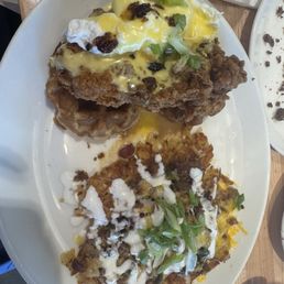 Chicken and waffles Benedict with loaded hashbrowns Chicken and waffles Benedict with loaded hashbrowns