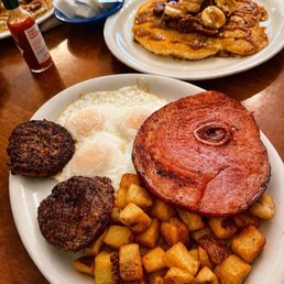 Delicious breakfast with eggs, ham, sausage patties, crispy potatoes, and banana pecan pancakes. Everything was hot, fresh, and flavorful! Delicious breakfast with eggs, ham, sausage patties, crispy potatoes, and banana pecan pancakes. Everything was hot, fresh, and flavorful!