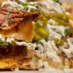 Delicias El Torito - Birria Nachos. Close up of the birria meat. Delicious.