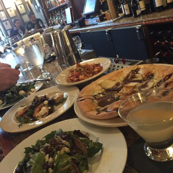 Assaggio Ristorante - Got a good mix of shrimp, Calamari, pizza and salad appetizers to share between us three ladies! - Italian Near Me - Seattle, Washington