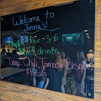 Jonna's Bar And Grill - a chalkboard with a menu on it - Pizza Near Me - Howell, Michigan