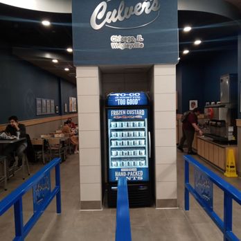 Culver's - A frozen custard vending machine is located in a Culver's restaurant in Chicago, IL, with seating and a drink station visible in the background. - Fast Food Near Me - Chicago, Illinois