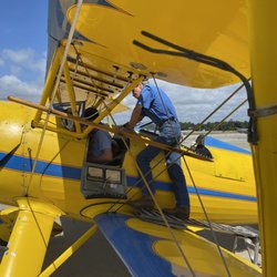 Coastal Biplane Tours - Strapping in