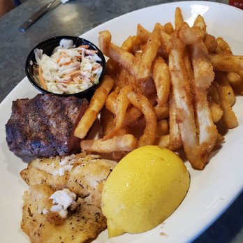 Northern Trails Bar & Grill - Surf and turf daily special, 1/2 order. We split this meal and they served each half on each plate. The pan fried blue gill was excellent - American Near Me - Newaygo, Michigan